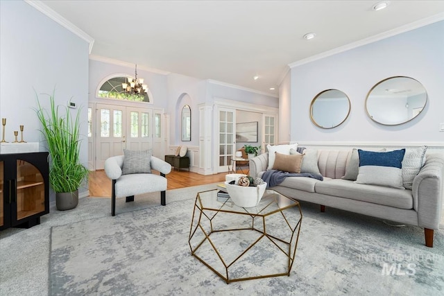 2368 SE 5th Way, Meridian, ID 83642 - living area with ornamental molding, a chandelier, recessed lighting, french doors, and wood finished floors
