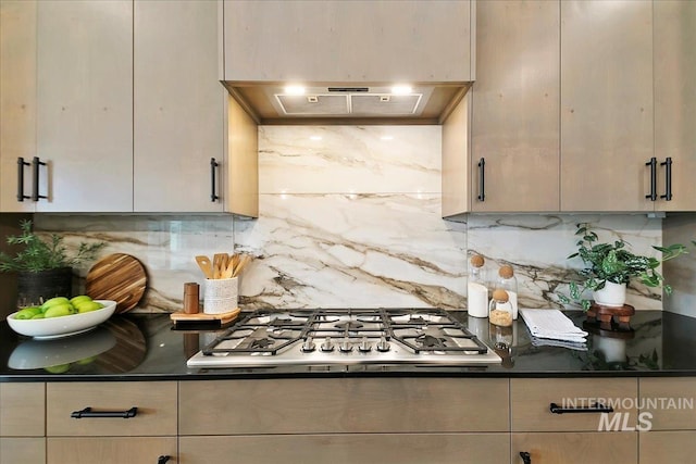 kitchen featuring backsplash, ventilation hood, and stainless steel gas cooktop