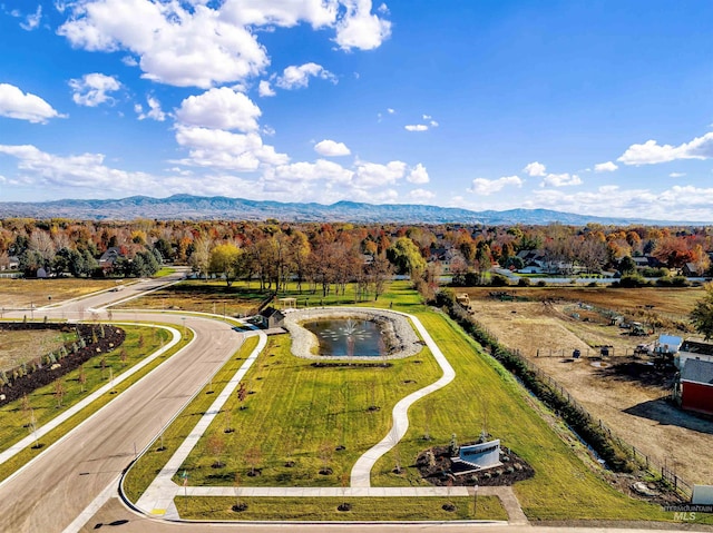 birds eye view of property with a mountain view