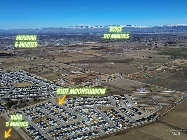 birds eye view of property featuring a mountain view