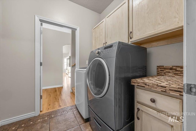 160 Summit Ridge Rd, Horseshoe Bend, ID 83629 - washroom featuring cabinet space, baseboards, and tile patterned floors
