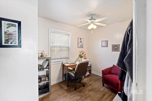 office space featuring hardwood / wood-style floors, ceiling fan, and a baseboard heating unit