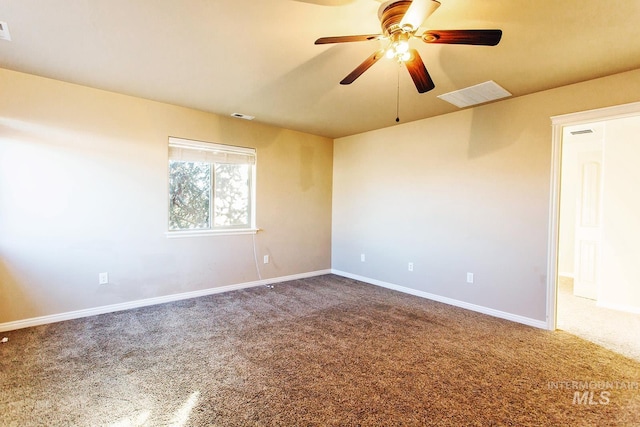 carpeted empty room featuring ceiling fan