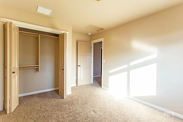 unfurnished bedroom with a closet and carpet