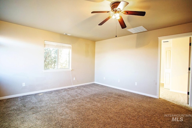 unfurnished room featuring ceiling fan and carpet