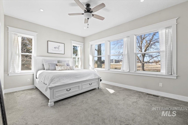 bedroom featuring recessed lighting, light carpet, visible vents, and baseboards