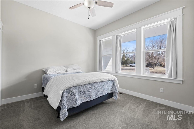 bedroom featuring ceiling fan, carpet floors, and baseboards