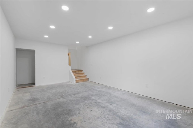 below grade area featuring stairway and recessed lighting