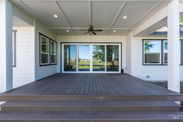 wooden terrace with a ceiling fan