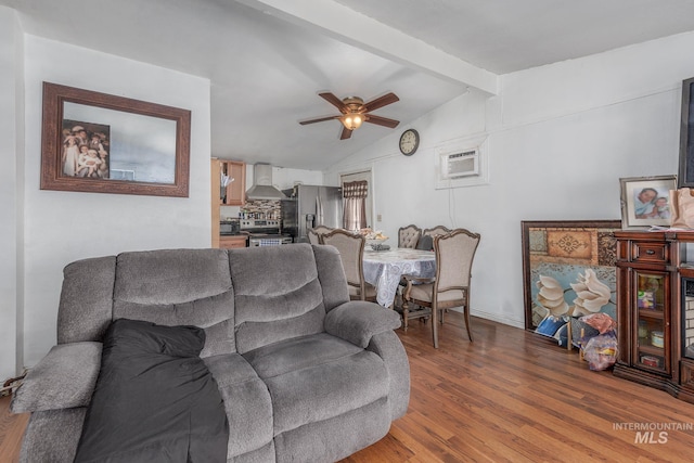 living room featuring lofted ceiling with beams, ceiling fan, wood-type flooring, and a wall mounted air conditioner