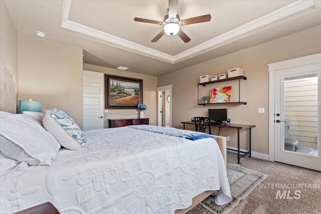 carpeted bedroom with a raised ceiling, a ceiling fan, baseboards, and ornamental molding