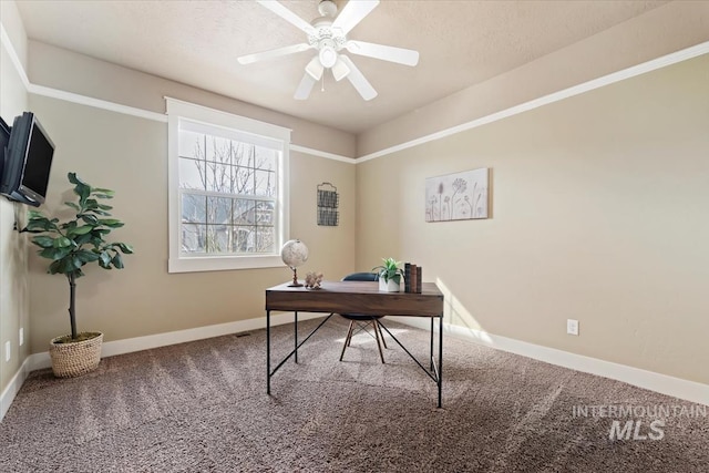 office with a ceiling fan, baseboards, and carpet floors