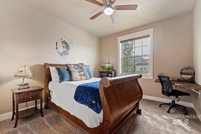 bedroom with ceiling fan, carpet, baseboards, and a textured ceiling