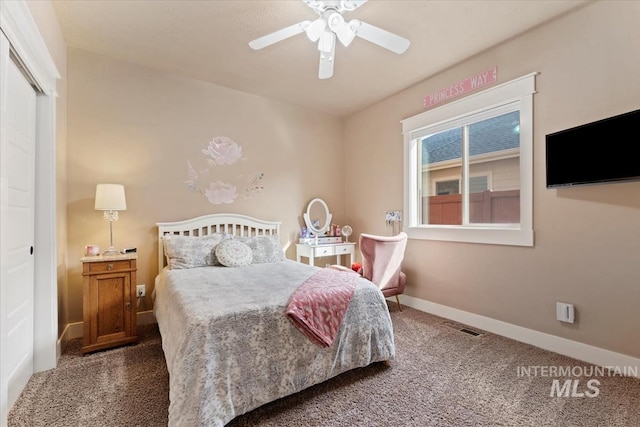 carpeted bedroom with a closet, visible vents, ceiling fan, and baseboards