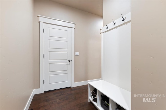 mudroom with baseboards and dark wood-style floors