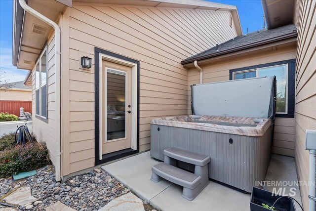 view of patio / terrace featuring a hot tub