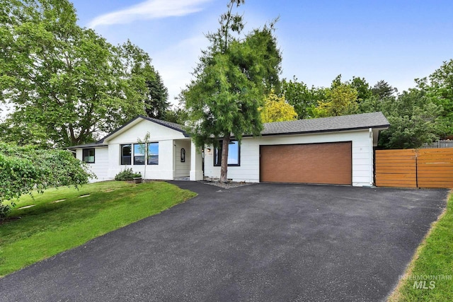 713 E Harcourt Rd, Boise, ID 83702 - single story home with an attached garage and asphalt driveway