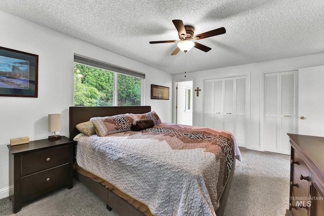 713 E Harcourt Rd, Boise, ID 83702 - carpeted bedroom featuring multiple closets, a textured ceiling, a ceiling fan, and baseboards