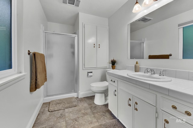 713 E Harcourt Rd, Boise, ID 83702 - full bath with vanity, a stall shower, toilet, and baseboards