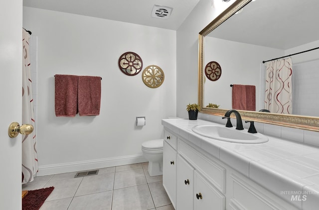 713 E Harcourt Rd, Boise, ID 83702 - bathroom featuring vanity, tile patterned floors, toilet, baseboards, and a shower with shower curtain