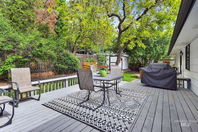 713 E Harcourt Rd, Boise, ID 83702 - wooden deck with a fenced backyard, outdoor dining space, and grilling area
