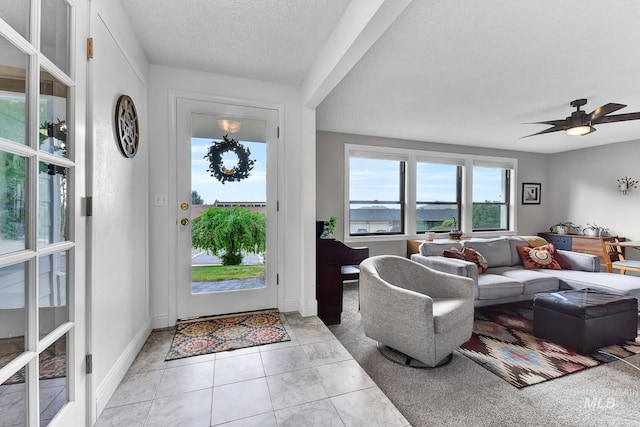 713 E Harcourt Rd, Boise, ID 83702 - entrance foyer featuring a textured ceiling, a ceiling fan, and baseboards