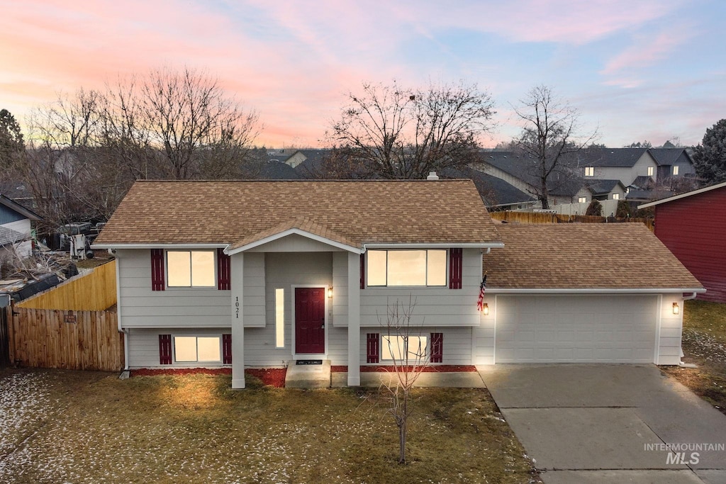 raised ranch featuring a garage