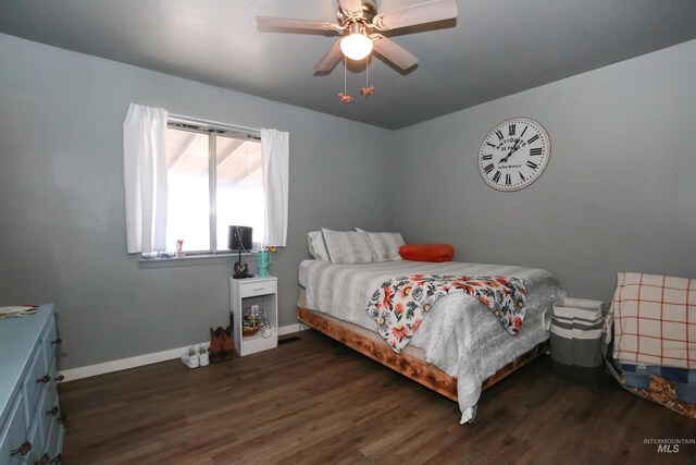 bedroom featuring dark hardwood / wood-style floors and ceiling fan