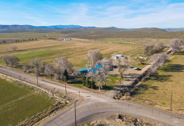 bird's eye view with a mountain view and a rural view