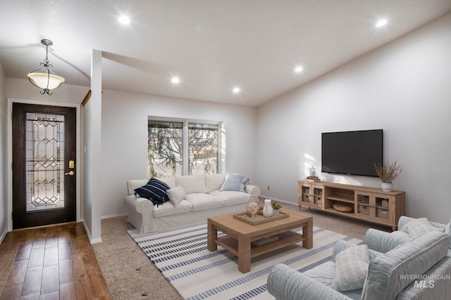 living room featuring recessed lighting, baseboards, and wood finished floors