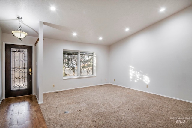 foyer featuring dark wood-style floors, recessed lighting, visible vents, and baseboards