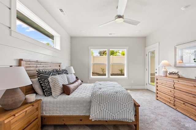 bedroom with multiple windows, carpet floors, and ceiling fan