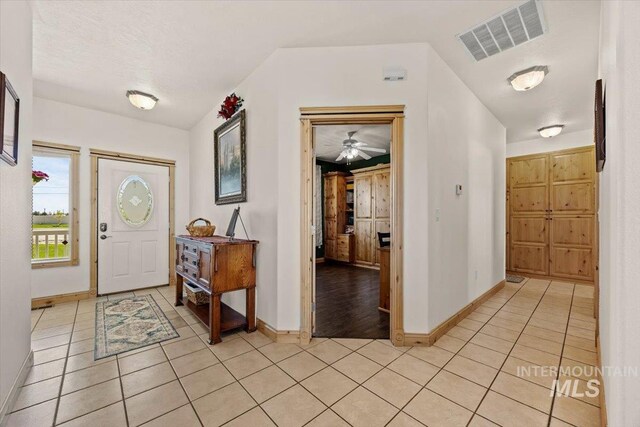 3415 Marble Front Rd, Caldwell, ID 83605 - entryway featuring light tile patterned flooring, baseboards, and a ceiling fan
