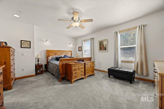 3415 Marble Front Rd, Caldwell, ID 83605 - bedroom with multiple windows, light colored carpet, and baseboards