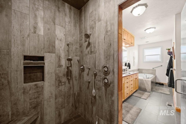 3415 Marble Front Rd, Caldwell, ID 83605 - full bathroom with a garden tub, walk in shower, tile patterned floors, and vanity