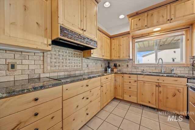 3415 Marble Front Rd, Caldwell, ID 83605 - kitchen with a sink, light brown cabinetry, black electric stovetop, light tile patterned floors, and under cabinet range hood