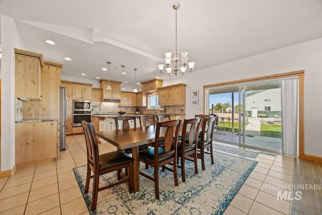 3415 Marble Front Rd, Caldwell, ID 83605 - dining room featuring light tile patterned floors, a chandelier, recessed lighting, lofted ceiling, and baseboards