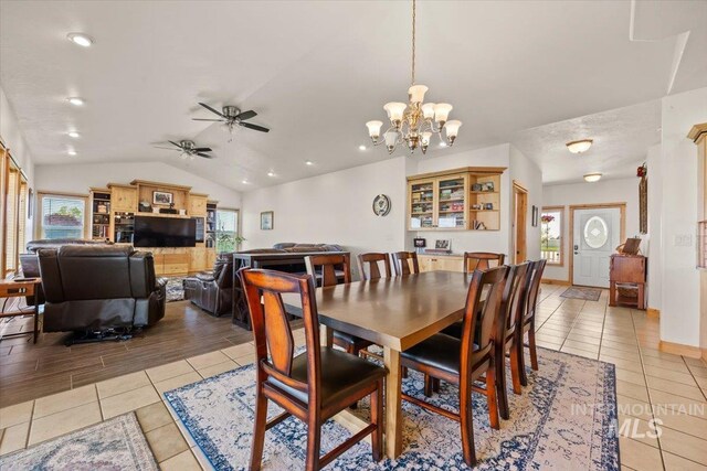 3415 Marble Front Rd, Caldwell, ID 83605 - dining space featuring light tile patterned flooring, plenty of natural light, lofted ceiling, a chandelier, and ceiling fan
