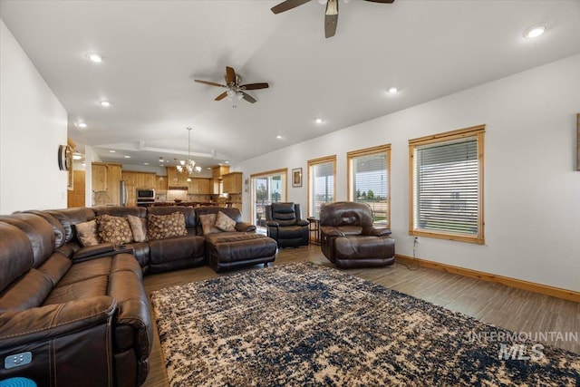 3415 Marble Front Rd, Caldwell, ID 83605 - living room with a ceiling fan, lofted ceiling, wood finished floors, a chandelier, and recessed lighting