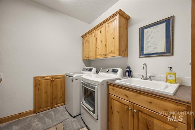 3415 Marble Front Rd, Caldwell, ID 83605 - laundry area featuring cabinet space, washer and clothes dryer, and light carpet