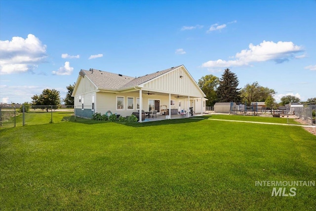 3415 Marble Front Rd, Caldwell, ID 83605 - rear view of property featuring ceiling fan, board and batten siding, a patio area, and a shingled roof