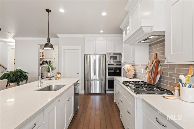 4071 S Twilight Rise Ave, Meridian, ID 83642 - kitchen featuring appliances with stainless steel finishes, white cabinets, backsplash, crown molding, and decorative light fixtures