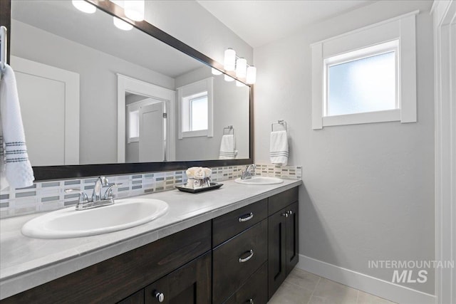 4071 S Twilight Rise Ave, Meridian, ID 83642 - bathroom with backsplash, double vanity, and tile patterned floors