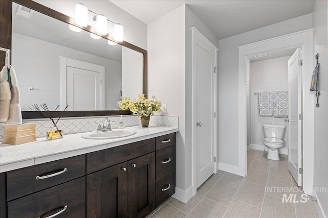 4071 S Twilight Rise Ave, Meridian, ID 83642 - full bathroom with vanity, tile patterned flooring, and backsplash