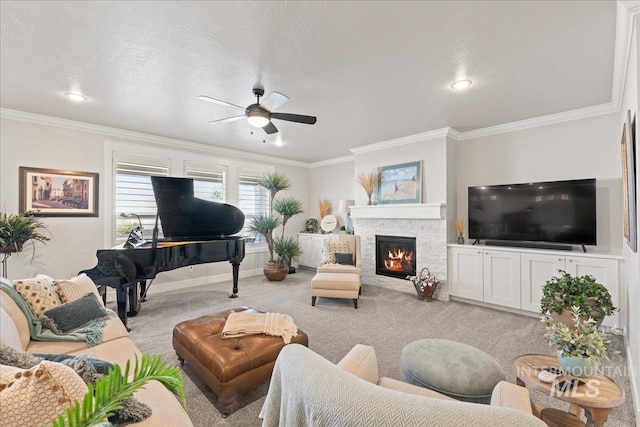 4071 S Twilight Rise Ave, Meridian, ID 83642 - carpeted living room featuring a ceiling fan, crown molding, a fireplace, and recessed lighting
