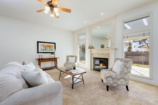 living room with light colored carpet and a wealth of natural light