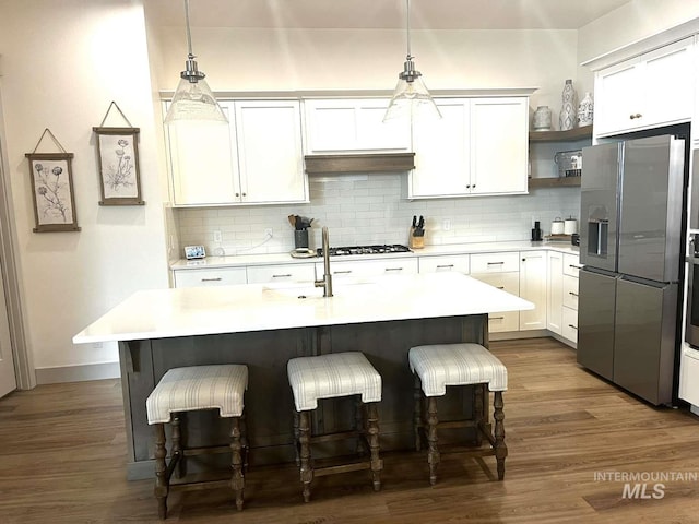 11703 W Amsonia, Star, ID 83669 - kitchen with stainless steel fridge, a sink, light countertops, and tasteful backsplash