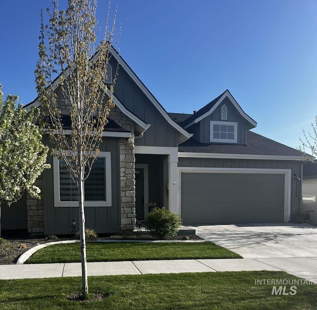 11703 W Amsonia, Star, ID 83669 - craftsman inspired home featuring board and batten siding, concrete driveway, stone siding, an attached garage, and a front yard