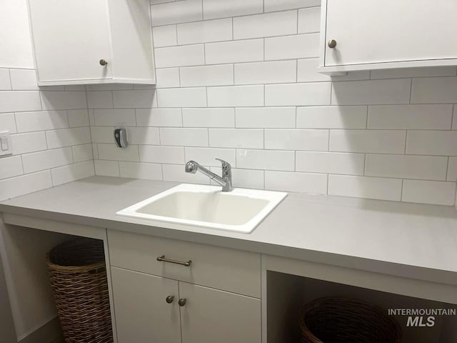 11703 W Amsonia, Star, ID 83669 - kitchen with a sink, white cabinets, tasteful backsplash, and light countertops