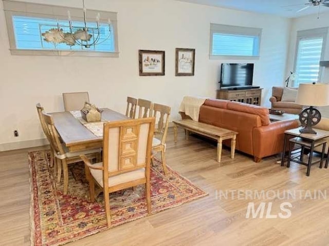 11703 W Amsonia, Star, ID 83669 - dining area featuring wood finished floors, ceiling fan, and baseboards